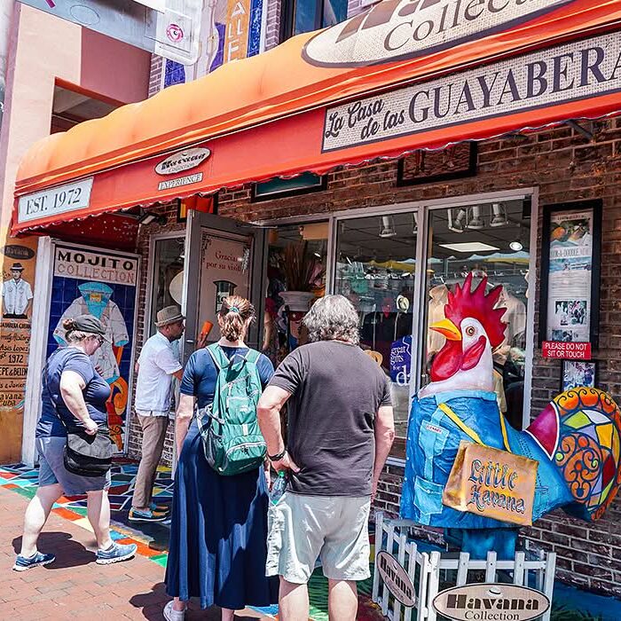 Visitors outside La Casa de las Guayaberas on Calle Ocho, Little Havana, Miami.