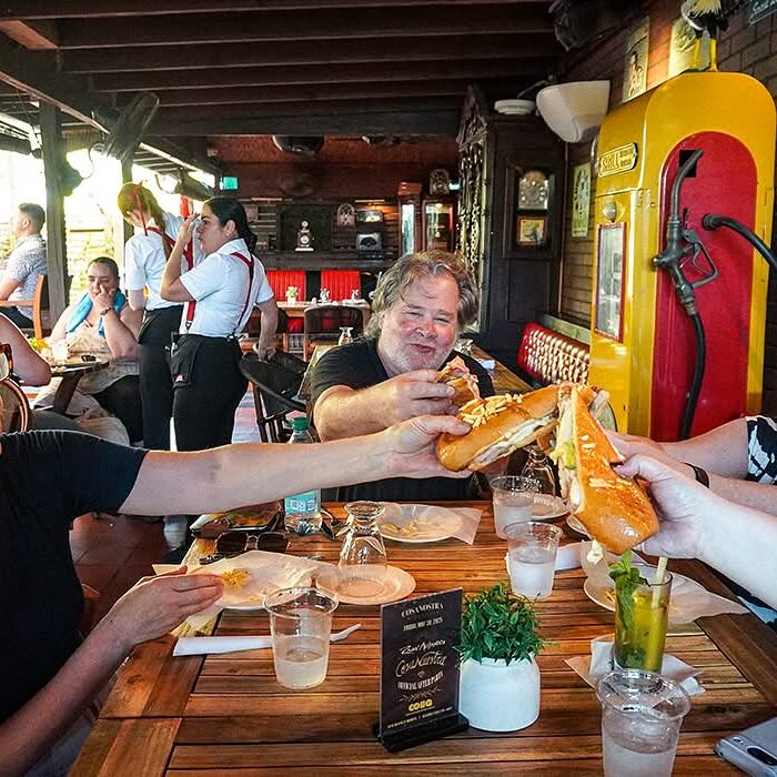 Guide and guests on a Little Havana food tour, Calle Ocho, Miami.