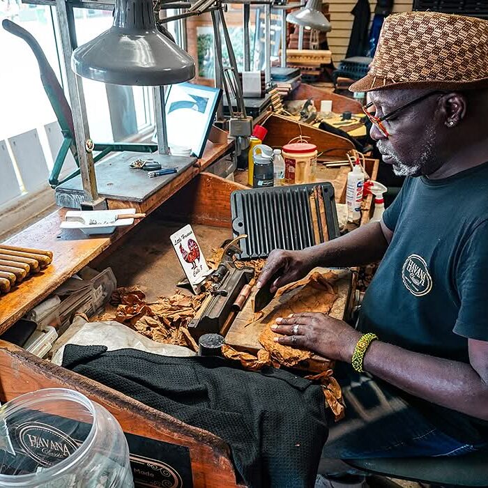 Cigar roller at work in a Little Havana cigar shop, Calle Ocho, Miami.